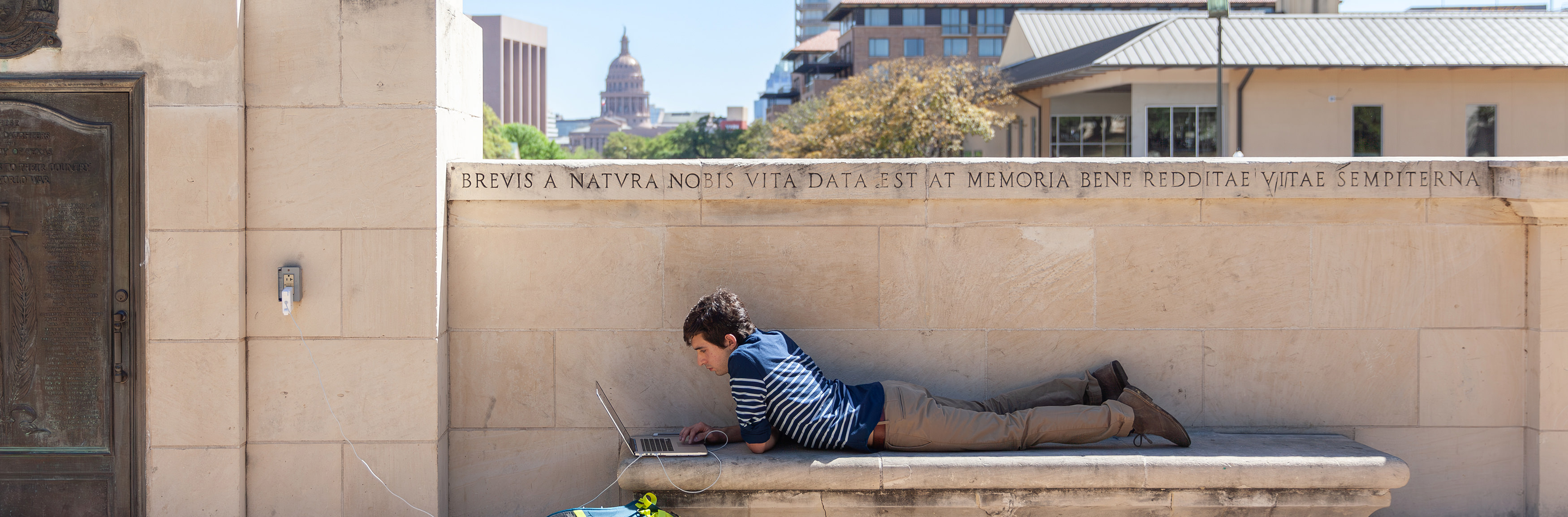 A student studies at the Littlefield Fountain