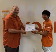 Eric Dieter, executive director of the McNair Scholars Program, left, and Orlan Oconer, right.