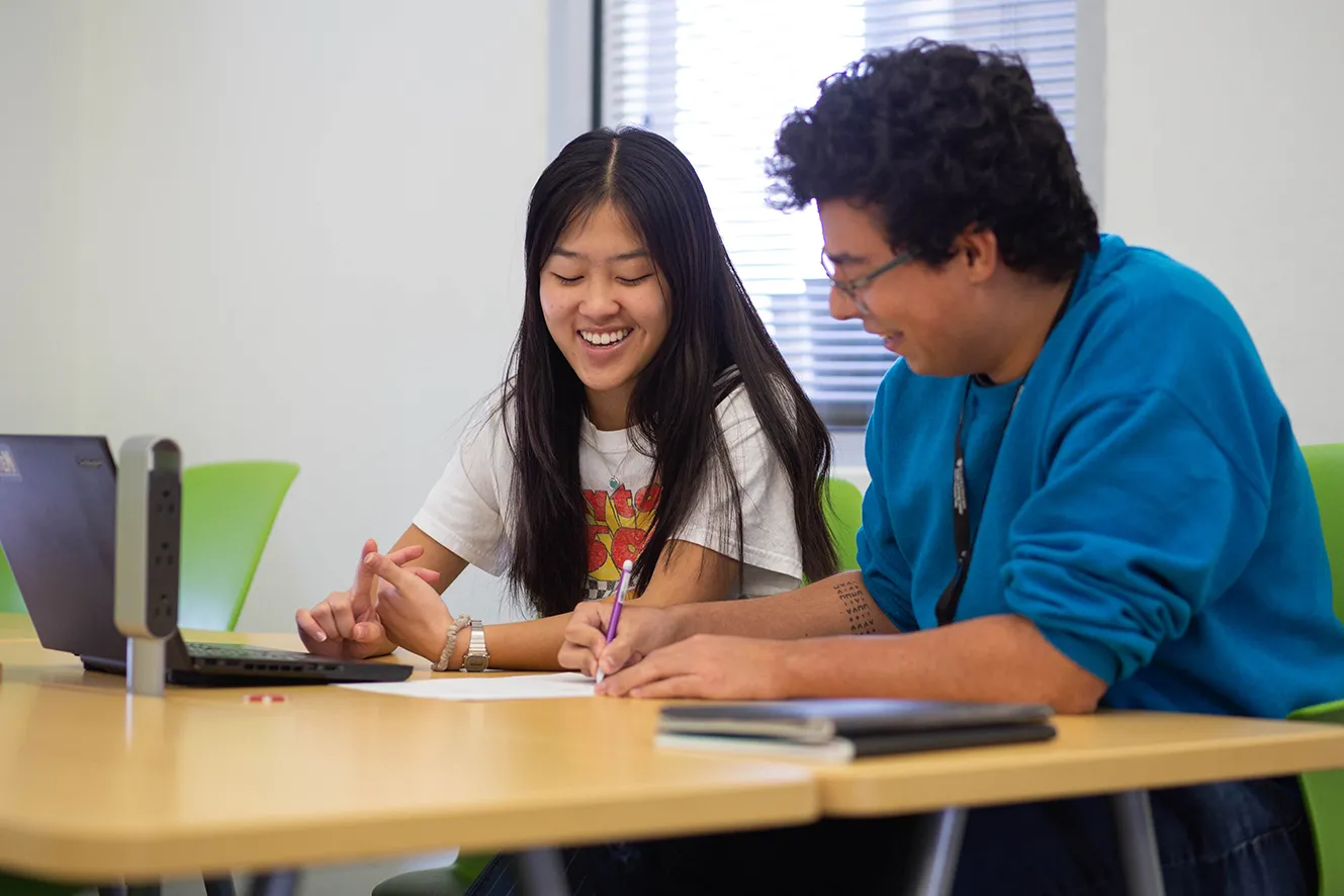 Tutor working with student