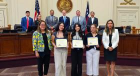 Karla Jimenez receiving an award