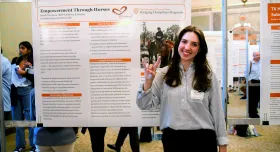 Sarah Tarrance in front of her poster at the BDP poster session