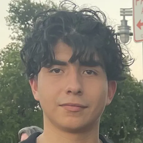 Eric's headshot in front of a tree
